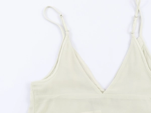 Detail of light beige chiffon camisole showing the V-neck and adjustable thin straps
