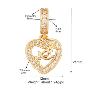Gold plated copper heart pendant with MOM lettering and cubic zirconia accents