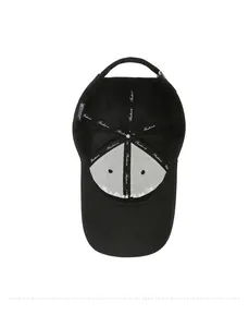 Interior detail of black cotton baseball cap showing Fashion tape and 100% cotton label