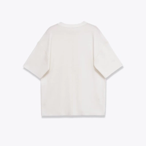 Haut en tricot blanc crème à col rond et manches courtes avec couture arrière verticale