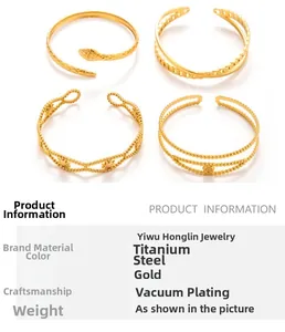 Detail of four gold vacuum-plated stainless steel cuff bracelets with snake and geometric motifs