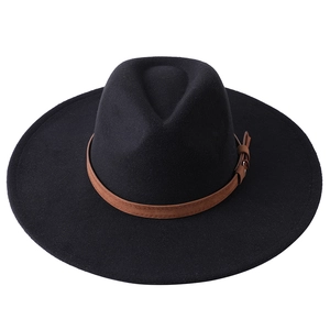 Detail of black felt fedora hat featuring a brown faux leather band and metal buckle