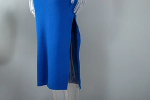 Detail view of royal blue knit dress featuring elegant side slit and ribbed texture
