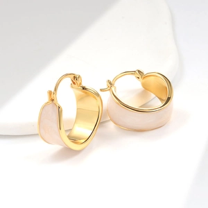 Elegant 18K gold plated hoop earrings with white enamel finish on a white background