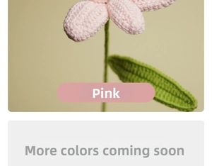 Detail of pink hand-knitted tulip flower with soft crochet texture and green stem