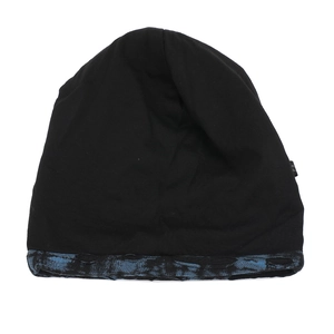 Close-up of black knitted slouchy beanie with blue tie-dye distressed hem detail
