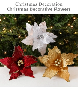 Close-up of red and gold velvet poinsettia flowers for Christmas wreath DIY decoration