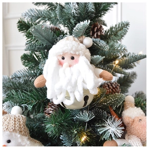 Detailed close-up of a Santa plush pendant with a large metal bell for Christmas tree decor