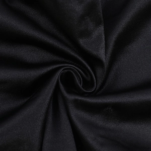 Macro shot of black ribbed knit fabric showing stretch texture and fiber detail of the top