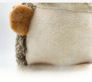 Close-up of cute plush hedgehog toy showing soft long and short fur fabric textures