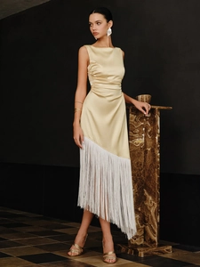 Elegant champagne gold satin sleeveless dress featuring white fringe hem and slim fit