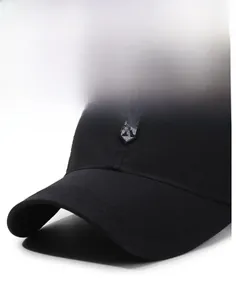 Detail of a black baseball cap featuring grey R embroidery and a structured sun visor