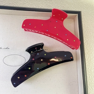 Elegant French acetate hair claw clips with colorful rhinestones in red and black