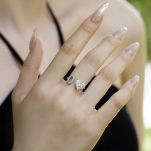 S925 silver adjustable ring featuring sparkling heart and oval zircon on a model's hand