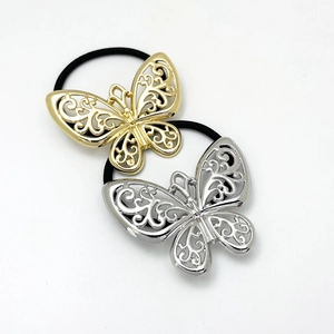 Set of two hollow metal bow hair ties in gold and silver finish with elastic band