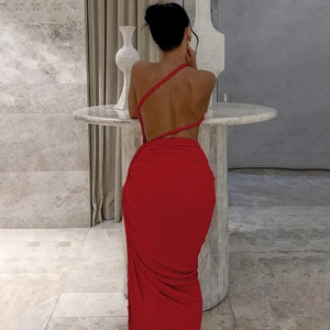 Detail of red ruched evening dress with one-shoulder braided rope strap and open back style