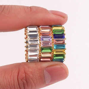 Three baguette-cut crystal rings in gold finish with colorful gemstone inlay for women