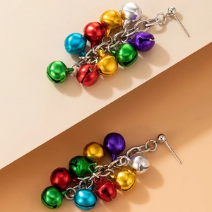 Detailed view of colorful Christmas bell earrings with red green and blue metal beads