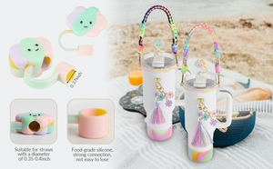 Close-up of food-grade silicone cloud straw covers and daisy tassel charms for tumblers