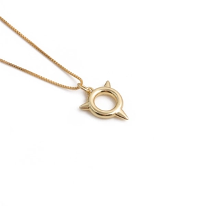 Gold plated necklace featuring a unique spiked ring pendant on a delicate box chain link