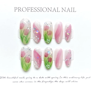 Detail of pink tulip press-on nails with silver glitter and pearl accents on 10 pieces set