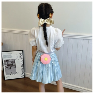 Detailed back view of a pink flower crossbody bag and little girl cute summer outfit