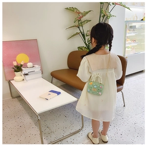 Girl's green crossbody bag with pearl handle and cartoon pattern for princess style