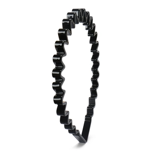 Detail showing high-gloss black wavy headband made of durable acetate board material