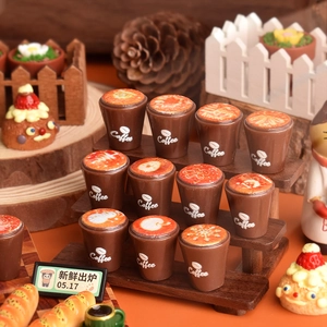 Miniature resin coffee cups and tiny pastries set in a cozy warm bakery scene