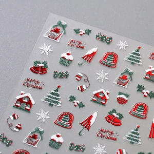 3D embossed Christmas nail art stickers featuring red and gold festive holiday patterns