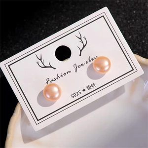 Close-up of pink-purple freshwater pearl earrings on S925 sterling silver pins