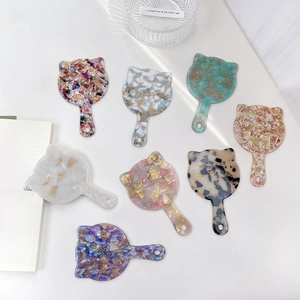 Cute cat-shaped acetate hand mirrors in various marble patterns for portable makeup