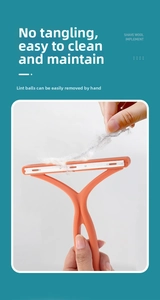 Close-up showing the easy removal of lint from the orange manual fabric shaver tool