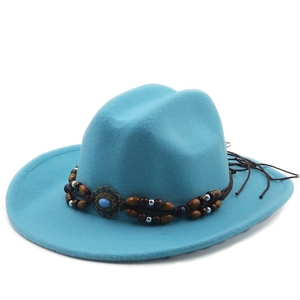 Detail of cyan wool felt fedora featuring a vintage ethnic bead band with turquoise stone
