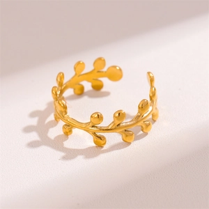 Minimalist golden olive leaf stainless steel open ring on soft matte background