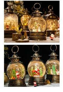 Close-up of vintage bronze Christmas lantern with LED light and micro snow scene