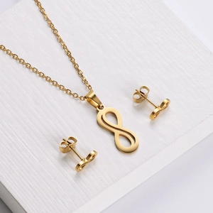 Golden stainless steel infinity jewelry set with matching necklace and stud earrings