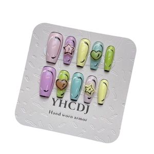 Handmade press-on nails with 3D hearts and colorful graffiti art in long coffin shape