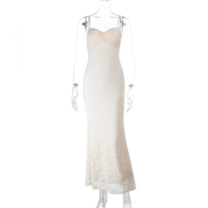 Detail of white lace slip dress featuring a slim mermaid cut and thin shoulder straps
