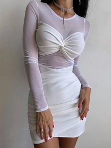 Close-up of mesh splicing and ruched knot detail on the sexy white bodycon dress