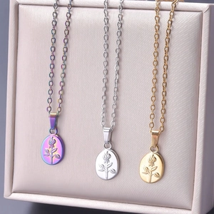 Detailed close-up of rose flower pendants in gold, silver, and rainbow steel finishes