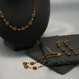 Bohemian gold stainless steel jewelry set with faceted brown crystal flower charms