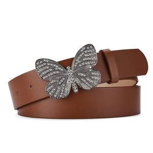 Detailed view of women's brown leather belt with a crystal-encrusted butterfly buckle