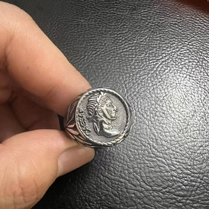 Macro view of Caesar portrait relief on vintage stainless steel signet ring for men