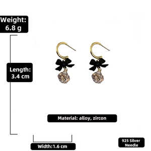 Detail view of bow zircon earrings showing dimensions 3.4cm length and 925 silver needles