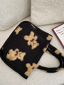 Cute teddy bear plush handbag made of black faux shearling with top handles