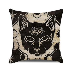 Detailed close-up of a black cat and moon phases design on a linen cushion cover