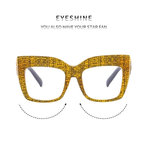 Detail of fashion square cat-eye glasses frame with yellow snakeskin pattern and gray temples