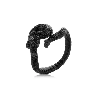 Detail of adjustable black snake ring featuring intricate scale textures and matte finish