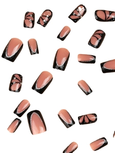 Short press on nails in nude pink and black with silver glitter and butterfly wing art